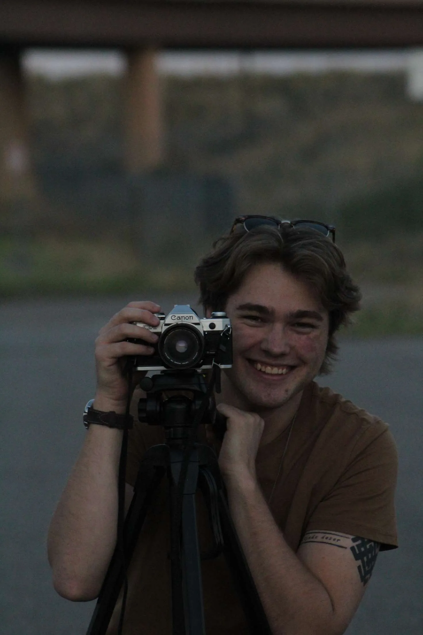 Casimir Stanley with a Canon film camera on a tripod